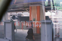 a woman walking through a train station