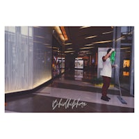 a man cleaning a mall with a mop