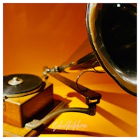 a gramophone on an orange background