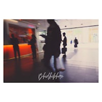 a blurry image of people walking in an airport