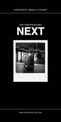 a black and white photo of a train with the words next