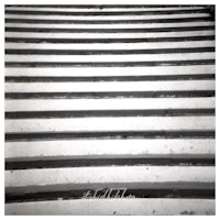 a black and white photo of a stairway
