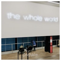 the whole world sign in an airport