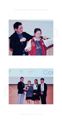 a group of people are standing in front of a stage