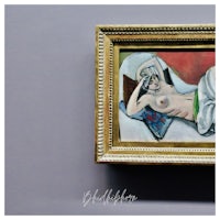 a painting of a nude woman in a gold frame