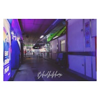 a hallway with purple lights in the background