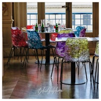 a group of colorful chairs in a restaurant