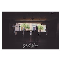 a silhouette of a couple standing in a hallway