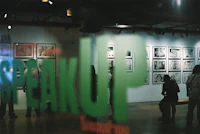 a group of people standing in front of a display