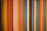 a colorful striped curtain hanging on a wall